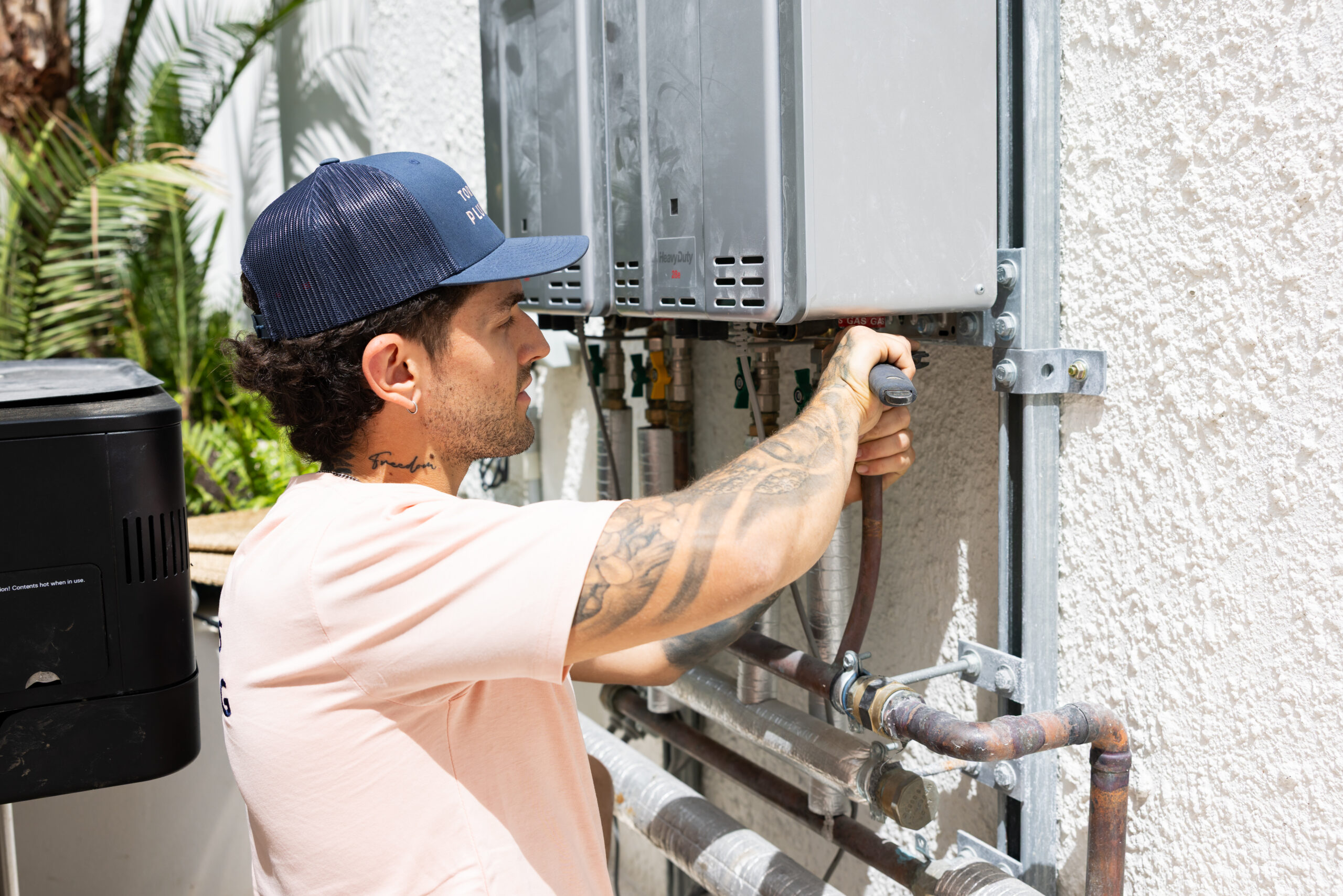 Technician repairing a hot water system